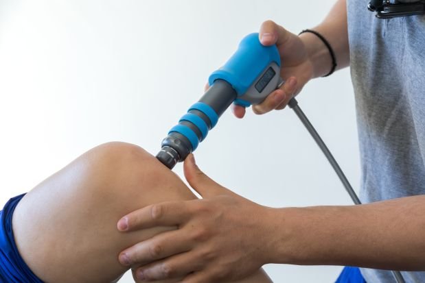 physical therapy of the knee and the foot with shock wave -Physiotherapy Salford - Media City, Salford Physiotherapy, first-class physiotherapy, Back pain management, Shockwave therapy Salford